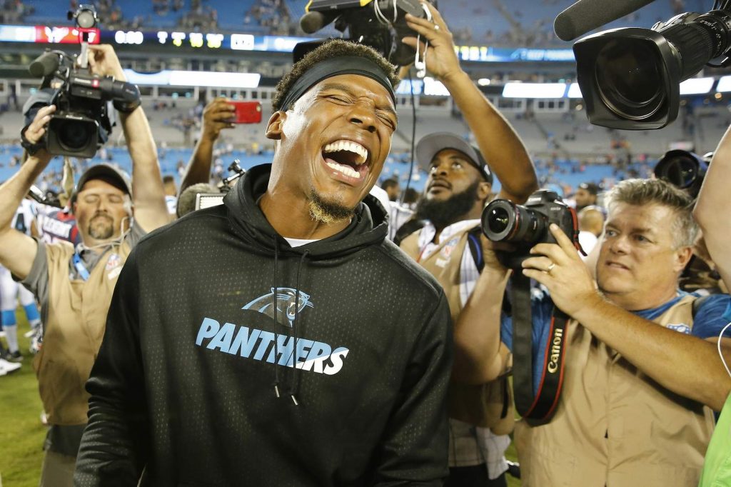FILE - In this Aug. 9, 2017, file photo, Carolina Panthers quarterback Cam Newton laughs after the second half of an NFL preseason football game against the Houston Texans, in Charlotte, N.C. The Panthers are parting ways with Cam Newton. Carolina general manager Marty Hurney said Tuesday, March 17, 2020, via Twitter the team is giving the 31-year-old quarterback permission to seek a trade _ although the former league MVP responded by saying he never requested one. (AP Photo/Jason E. Miczek)