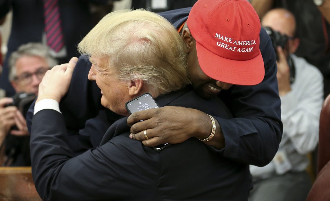 President Donald Trump hugs Kanye West during a meeting at the White House in 2018.Pool - Getty Images